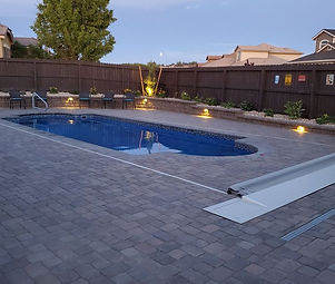 Custom paver pool deck and landscaped backyard